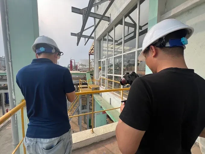 ProMedia crew filming on factory catwalk in Vietnam